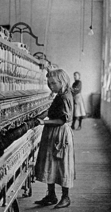 A young child working in a textile mill