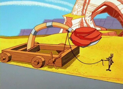 Gif of Wile. E.  Coyote launching a boulder onto his own head.