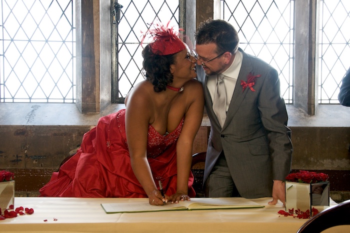 The author and his wife signing their wedding vows at in Tower Bridge, London.